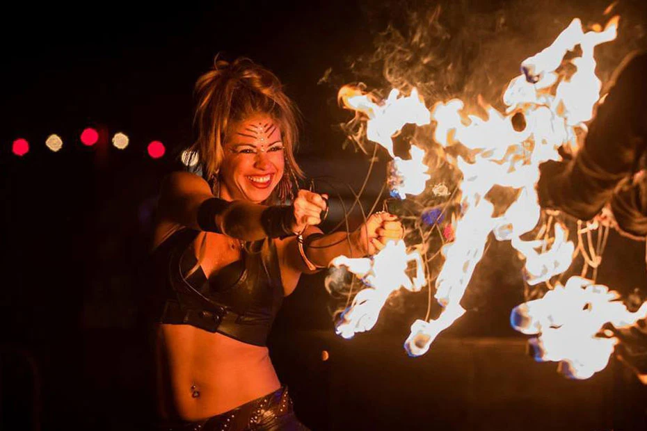 Debby Carrigan performing with a fan of fire